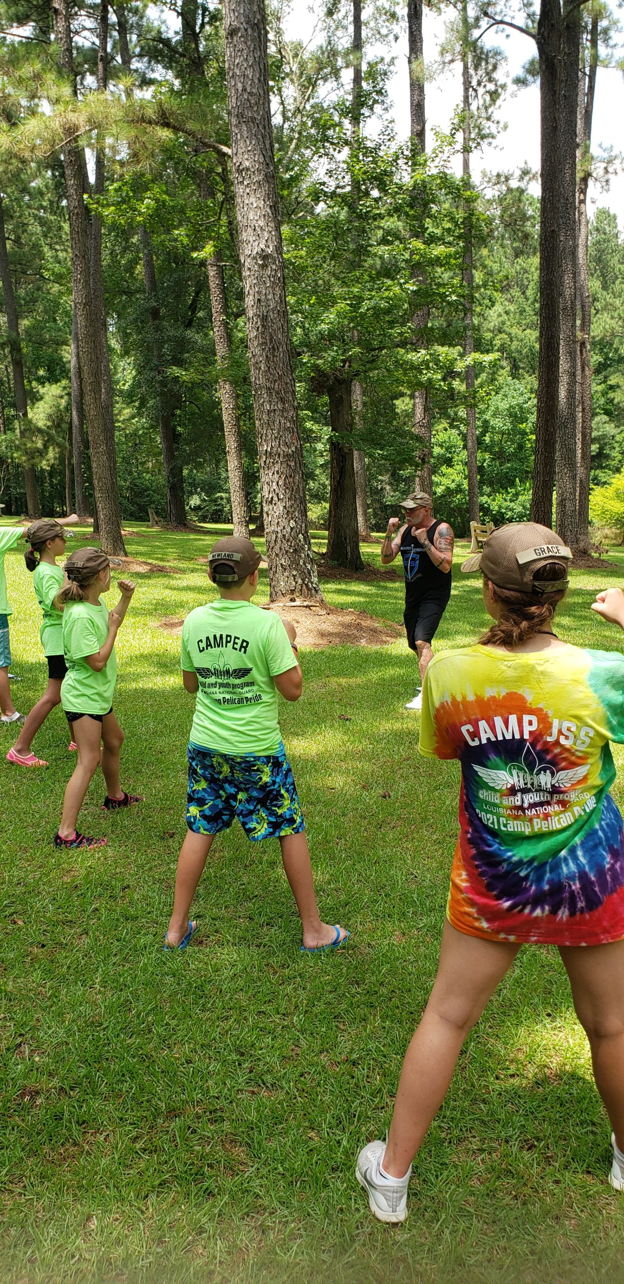 Wolverine teaching some basic martial arts moves to the campers.
